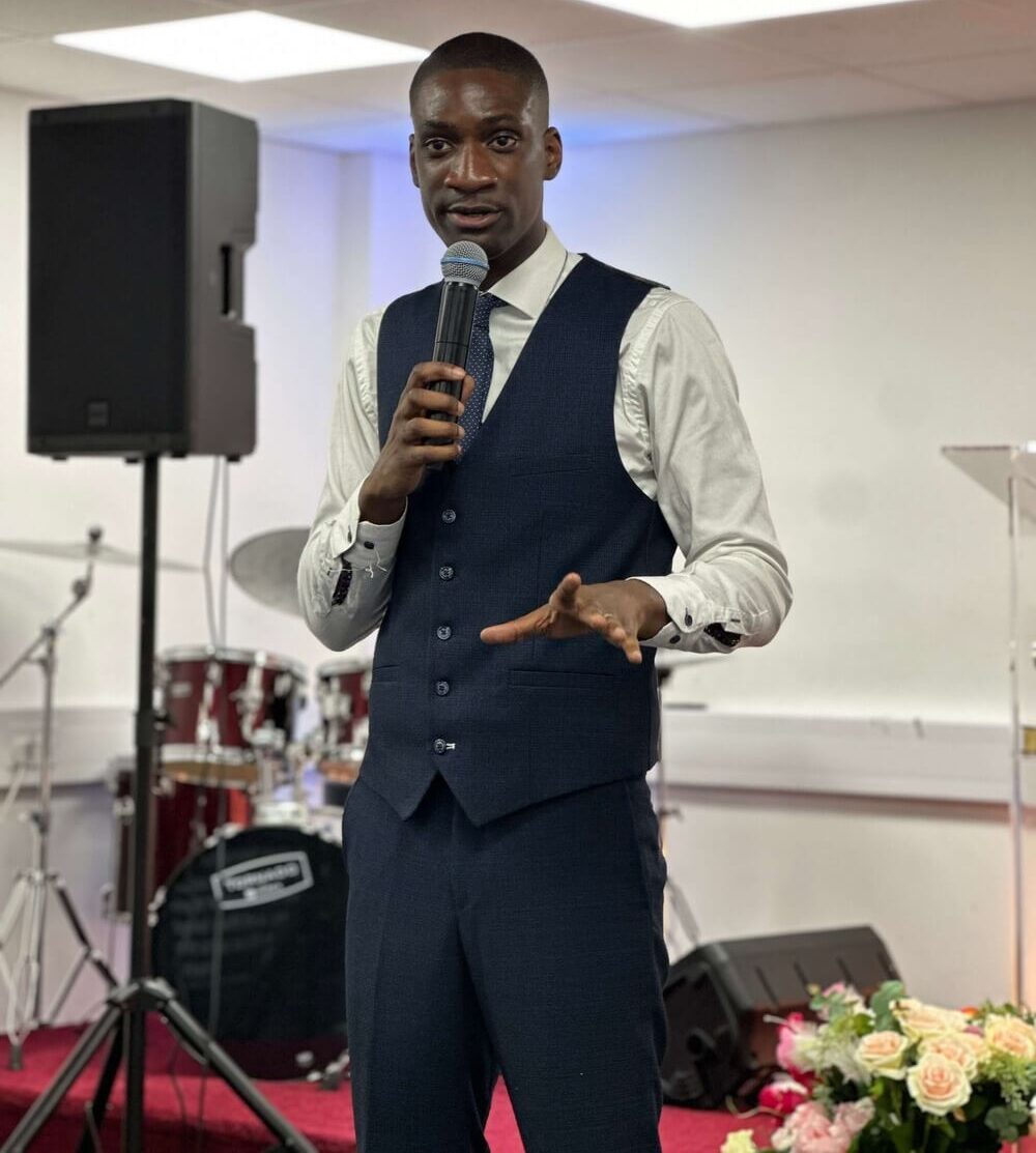 Pastor Sam preaching in church